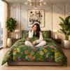 Woman sitting cross-legged on a double bed dressed in a green floral cotton bedsheet set